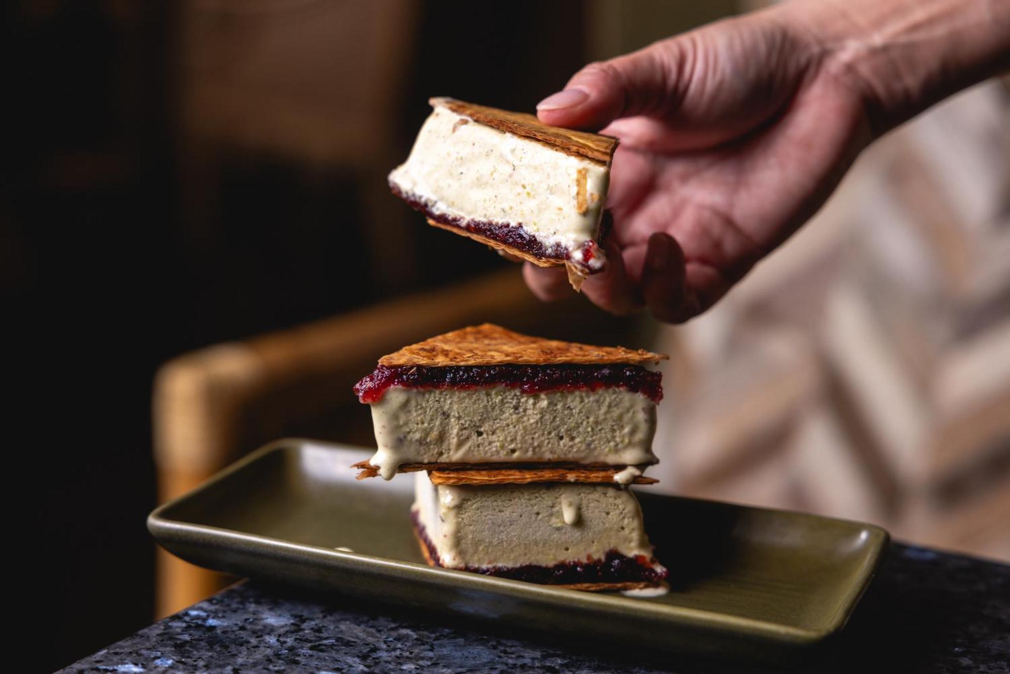 Ovolo The Valley Brisbane Bagian luar foto A hand holding a piece of ice cream sandwich
